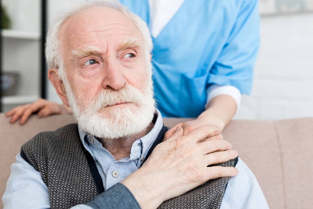 Common Signs of Nursing Home Abuse in Missouri represented by sad elderly man